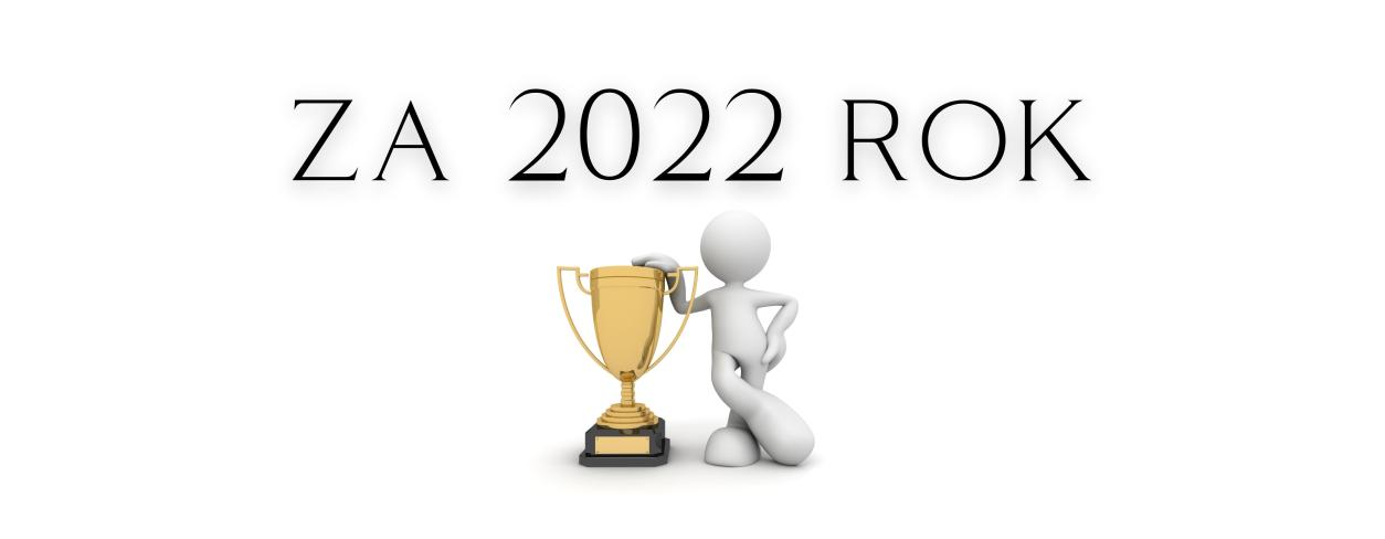 Tekst "za 2022 rok" postać z pucharem 